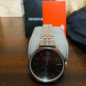 Nixon unisex stainless steel watch. Never worn, tossed original box.
